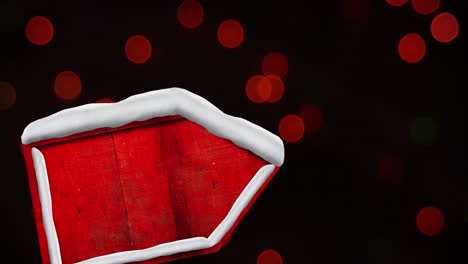 animación digital de un cartel rojo cubierto de nieve contra manchas rojas de luces