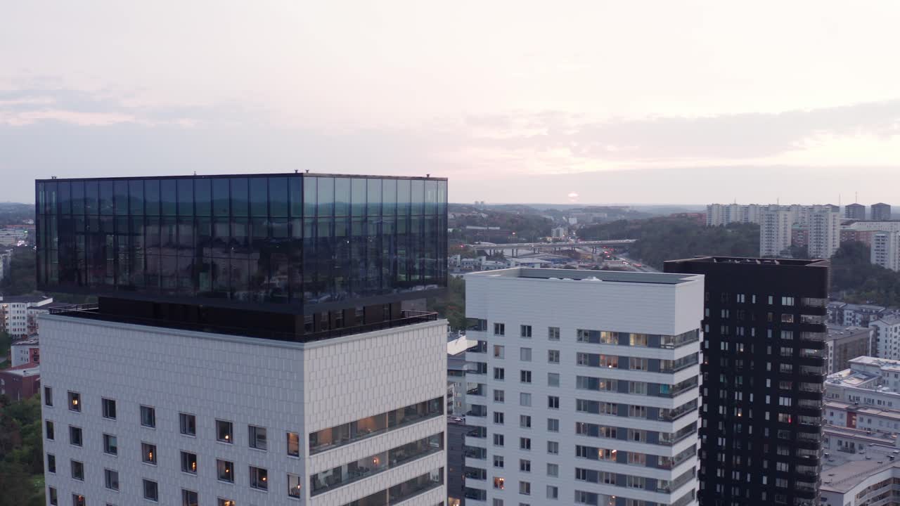 Drone footage of high-rise residential buildings with modern design and architecture in &Aring;rstadal, Stockholm