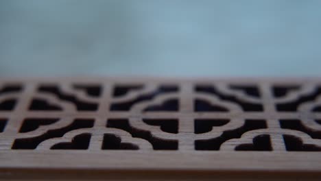 a close-up macro shot of smoking incense in a wooden box, spiritual ritual meditation, scented therapy fragrance, relaxing aromatic white smoke, textured case, cinematic 4k video tilt up