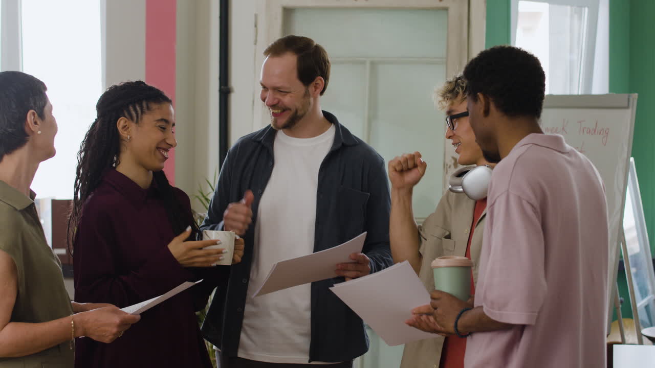 Diverse colleagues discussing business documents in an office