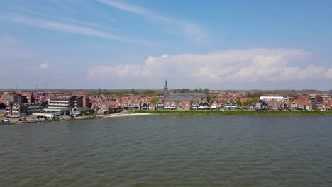 revealing drone shot of the coast of volendam, the netherlands