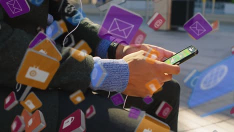 Man-sitting-at-a-sidewalk-while-texting