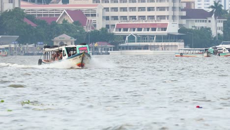 a boat travels along bangkok's chao phraya river