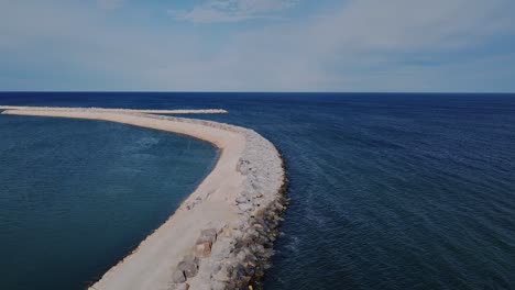 Aerial-Flyover-Ocean-Reef-Marina-Breakwater-Construction,-Perth