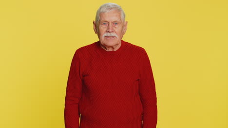 happy old man smiling friendly waving hands gesturing hello greeting or goodbye meeting invitation