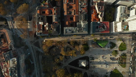 Aerial-birds-eye-overhead-top-down-panning-footage-of-Plaza-de-Espana-square-and-surrounding-streets.-Rooftop-shot-of-apartment-buildings-in-residential-neighbourhood.