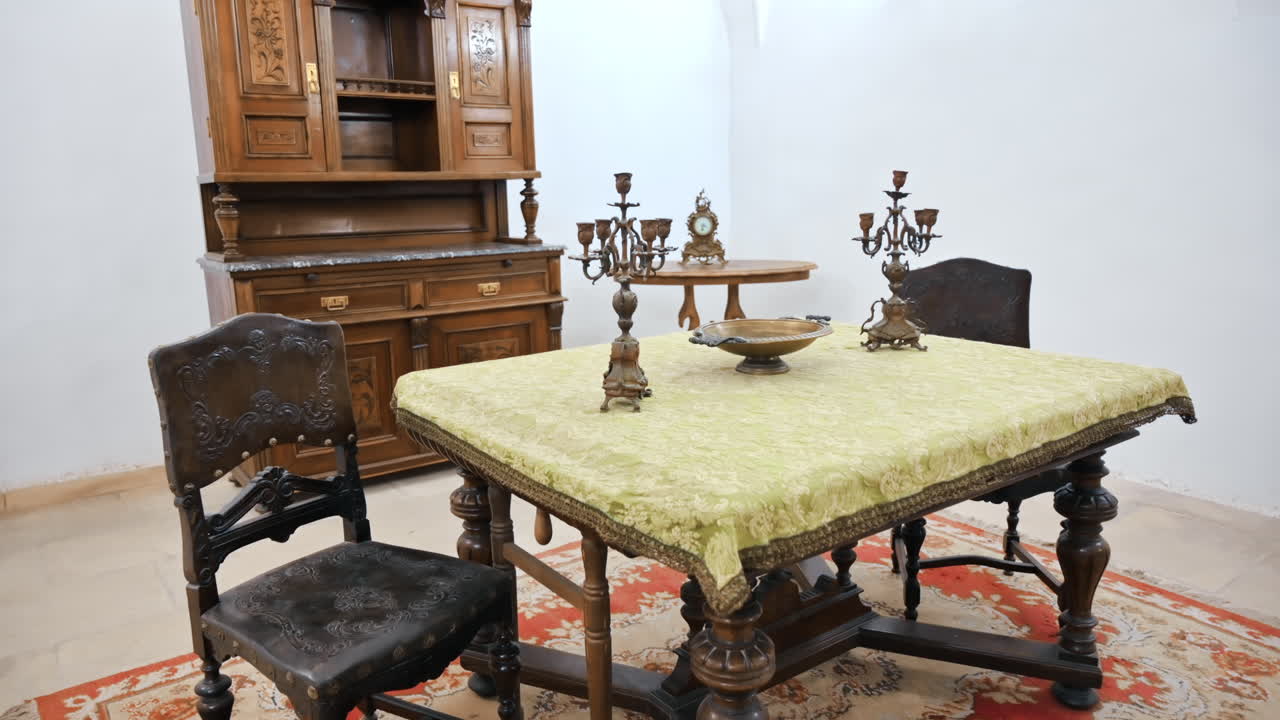 HUNEDOARA, ROMANIA - MAY 22, 2023: View of the Corvin Castle interior, Hunedoara, Romania. Room with wooden furniture