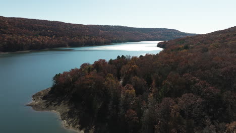 panoramic view over lake fort smith during autumn in arkansas, united states - drone shot