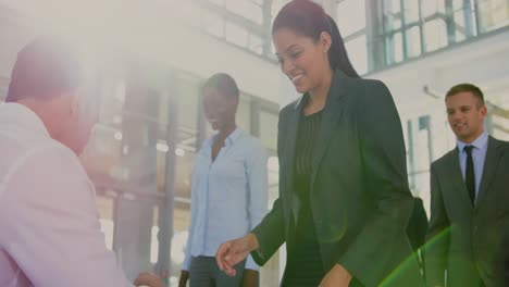 Businesswoman-checking-in-at-conference-registration-table-4k