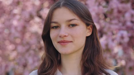 young woman in spring flowers