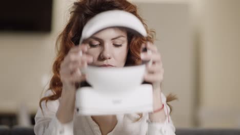 young lady using virtual glasses. portrait of woman sitting with video glasses.