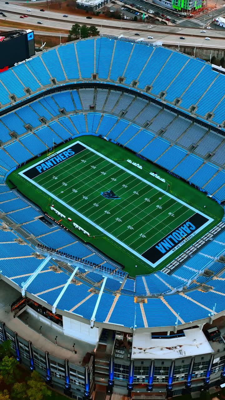Football stadium in uptown Charlotte, North Carolina, United States. Top view on the Bank of America Stadium with slow distancing from it. Vertical video