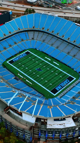football stadium in uptown charlotte, north carolina, united states. top view on the bank of america stadium with slow distancing from it. vertical video