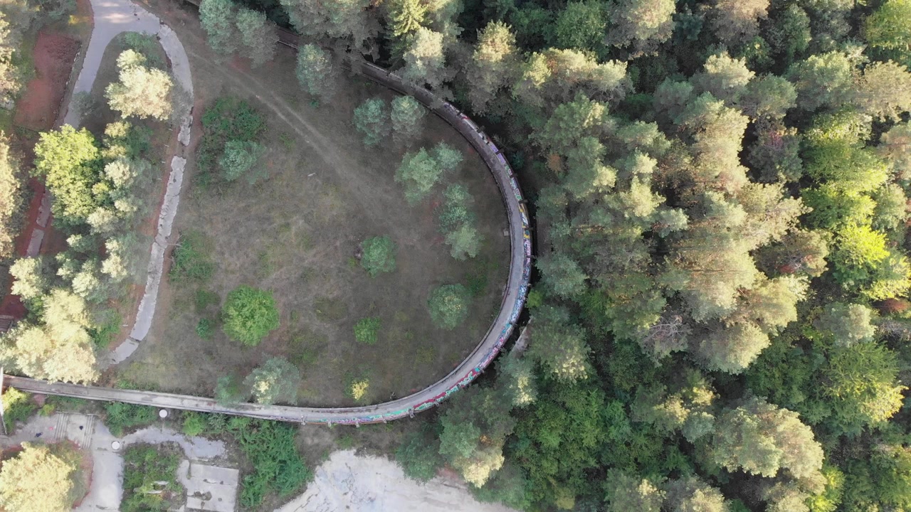 Aerial: Sarajevo Olympic Bobsleigh track in Trebević mountain. Zenital shot