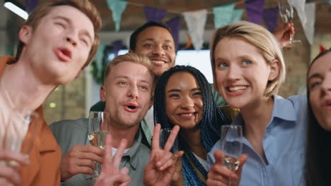 team making selfie party for company anniversary close up. friends laughing