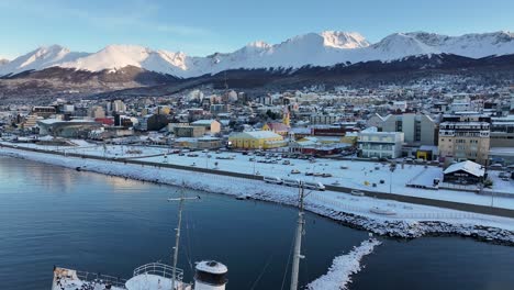 aerial view of snow covered city with shipwreck