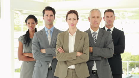 Serious-business-people-looking-at-camera-with-arms-crossed