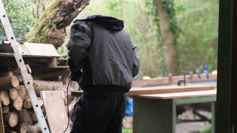 Outdoor Workshop man power carving Wood wearing protective mask