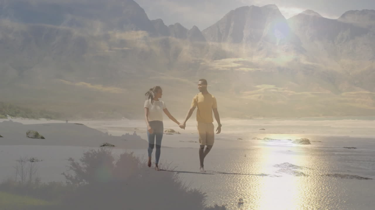 couple walking on sandy beach using phone overlay showing travel route path and distance icons
