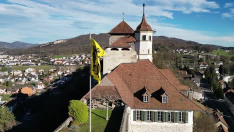 aarburg aargau switzerland flag closeup with crest in the wind static aerial