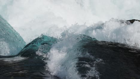 detailed slow-motion view: clean, whirling crashing water of the loen lake