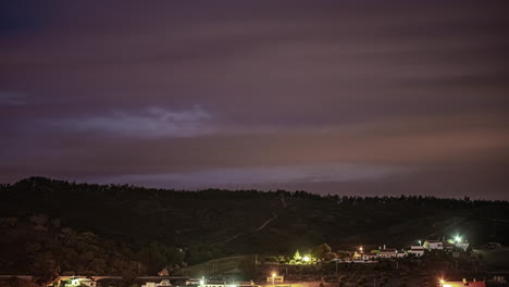 Timelapse-of-thunderstorms-with-lightning-moving-over-the-hills-during-night