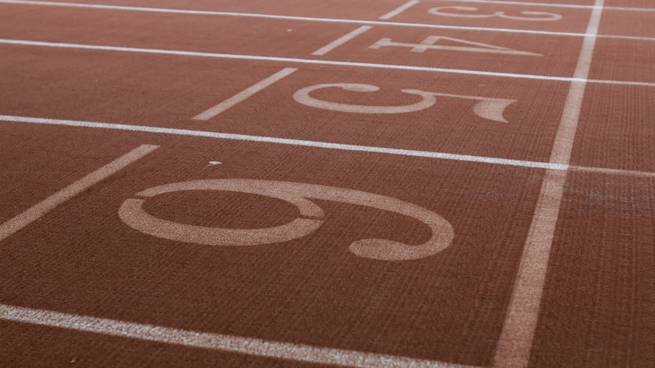 Close-up of Running Track Lanes with Numbers