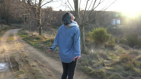 traveler enjoying the sun during a walk, breathing the mountain air