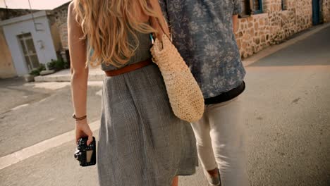 young tourists couple walking in old town in europe