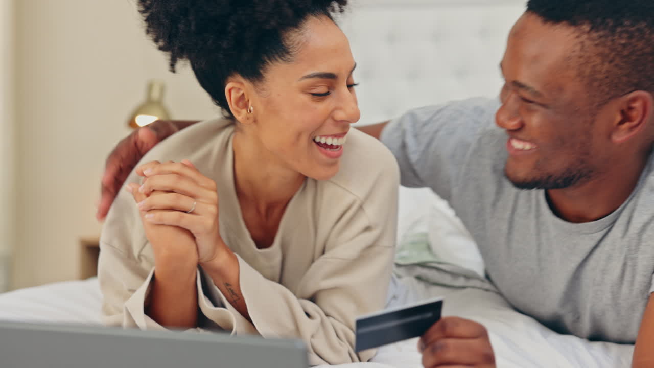 Laptop, couple and online shopping with credit