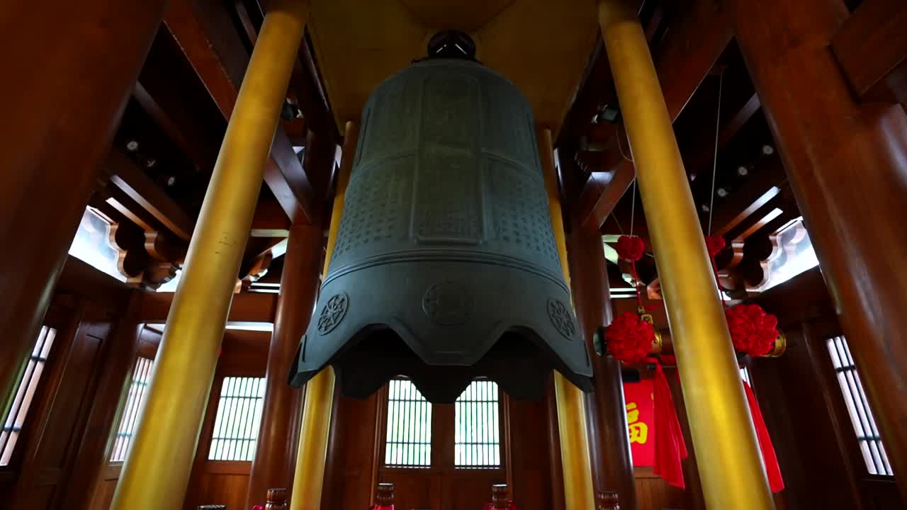 Peace Bell weighing 20 tons inside a small pagoda of Jingan Temple, Shanghai, China