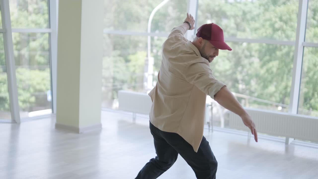 Man Breakdancing in Modern Studio