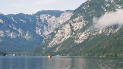 slow motion landscape still shot of boat on lake bohinj with slovenia mountains triglav national park valley ljubljana europe 1920x1080 hd