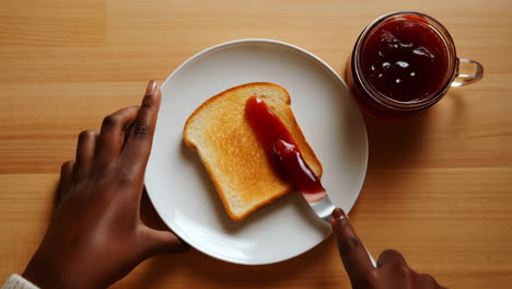 spreading jam on toast