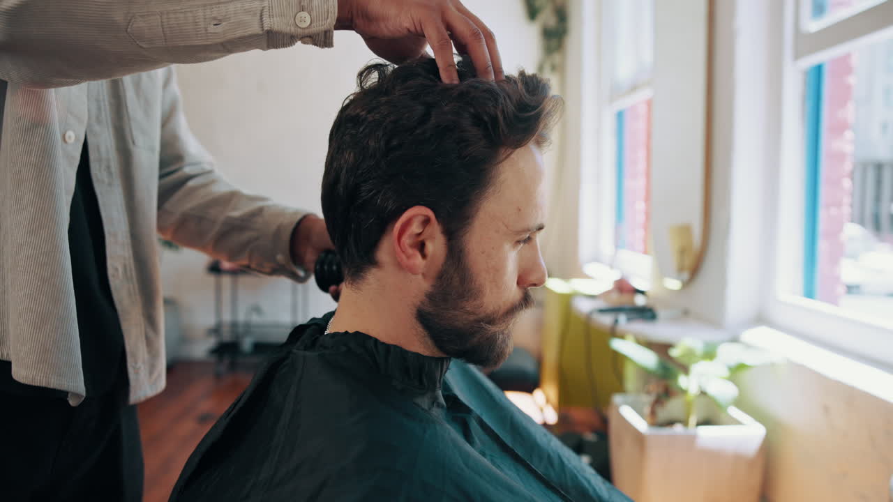 Barber Brushing Hair Off Client's Neck in a Modern Barbershop