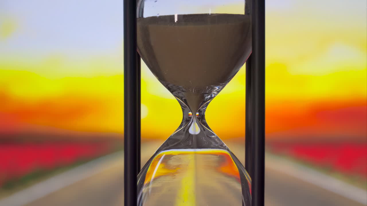 Enchanted Fantasy art hourglass with sand running through it, measuring passage of time as gravity pulls the granules from one chamber to another