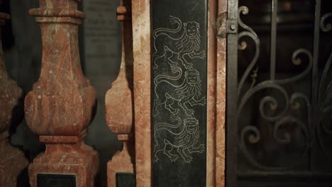 close up shot of a small lion decoration in a chapel of a big church in italy