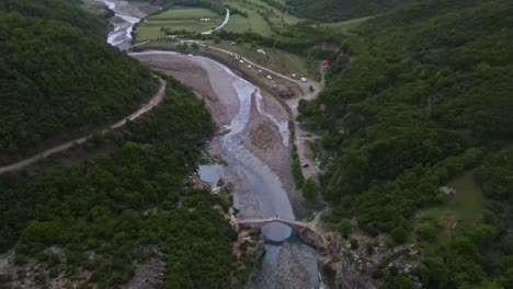 drone looking down at the valley with benja thermal baths and vjosa river in albania