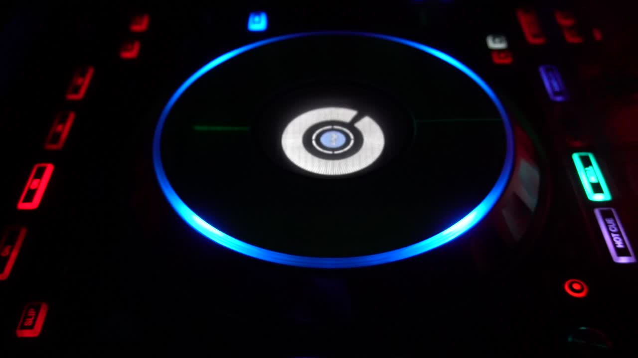 Downward shot of a Dj booth spinning in a night club, HD 1080p, 59.94p B Roll