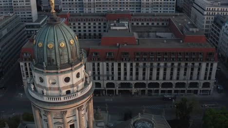 AERIAL:-Berlin-Gendarmenmarkt-German-Church-Tower-Close-Up-at-Dusk