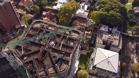 Aerial-flyover-cranes-working-on-roof-of-new-skyscraper-building-in-Downtown-of-Buenos-Aires---Capital-of-Argentina