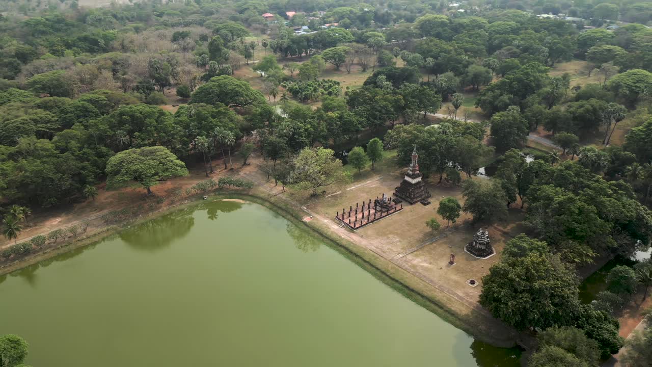Aerial View of Ancient Temples and Pond in Sukhothai Historical Park, Thailand