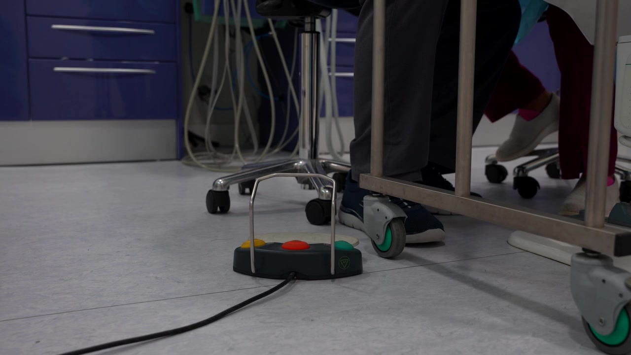Dental clinic floor with dental tools and wires in use by dentists during a procedure