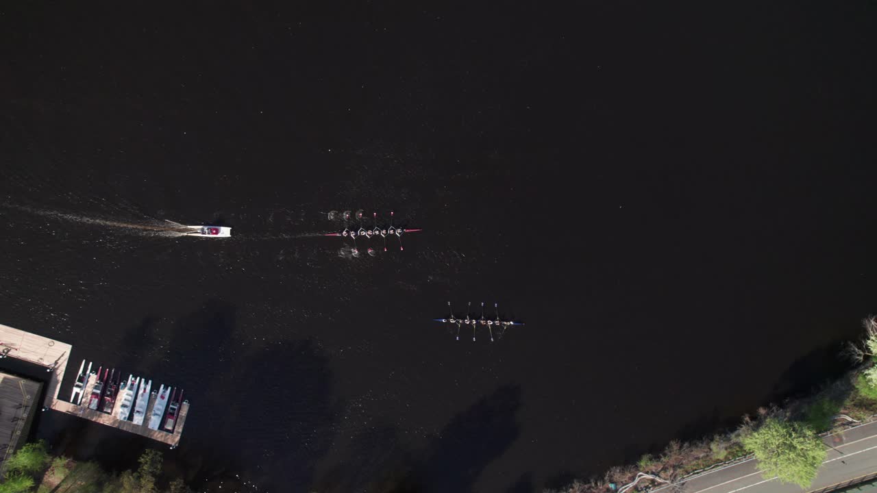 Aerial overhead of 8-man rowboats, Harvard University, Boston, 4K