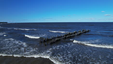 a wooden structure in the middle of a body of water