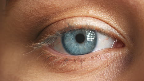 Zoom-on-blue-eye,-woman-and-vision-for-humanity