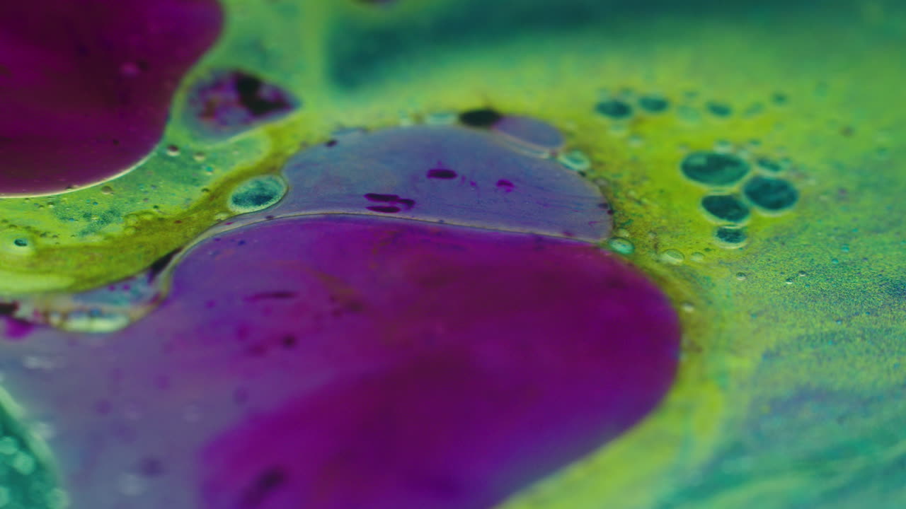 Colourful, organic, liquids macro shots buzzing and flowing