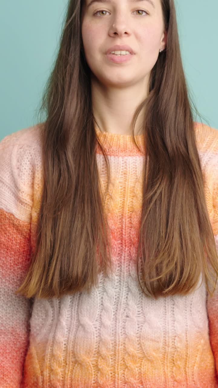 Expressive young woman laughing with joyful energy