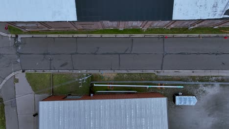 aerial of a small side street between storage buildings