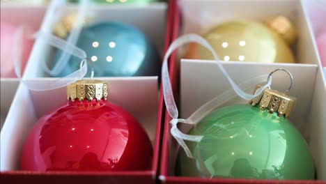 close-up view with a narrow focus on colorful christmas tree balls arranged in a box